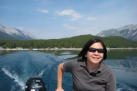Jenna driving the boat on Lake Minnewanka