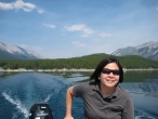 Jenna driving the boat on Lake Minnewanka