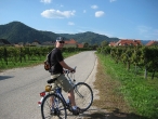 Ben biking through vineyards