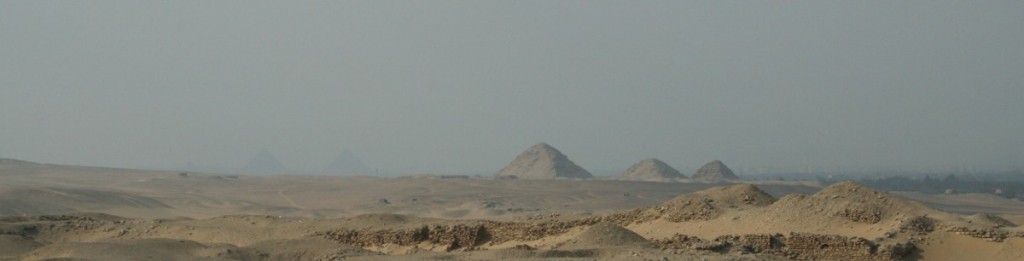 Abu Sir pyramids near Cairo, Egypt and the Giza Pyramids very faint in the distance